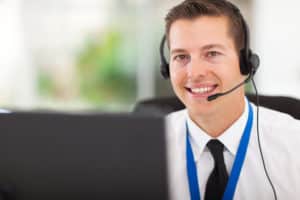 smiling male customer support operator with headset